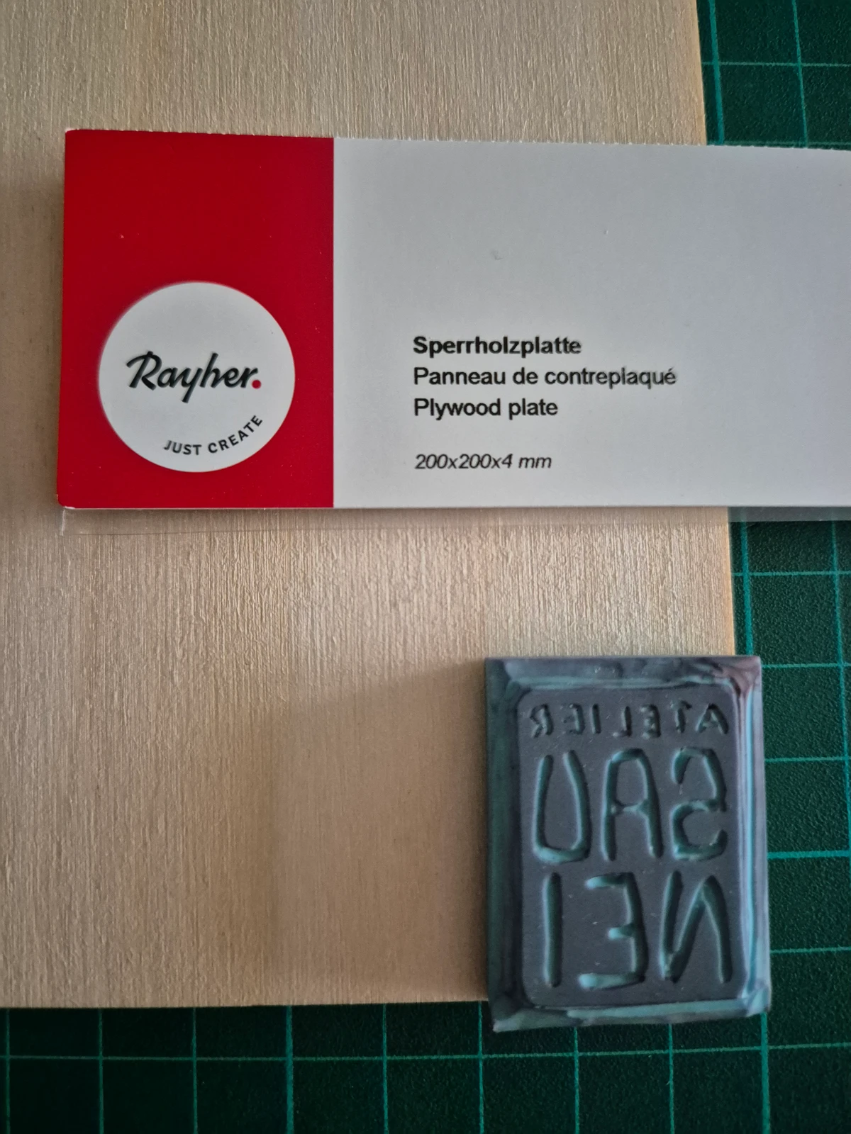 Plywood panel and stamp to mount